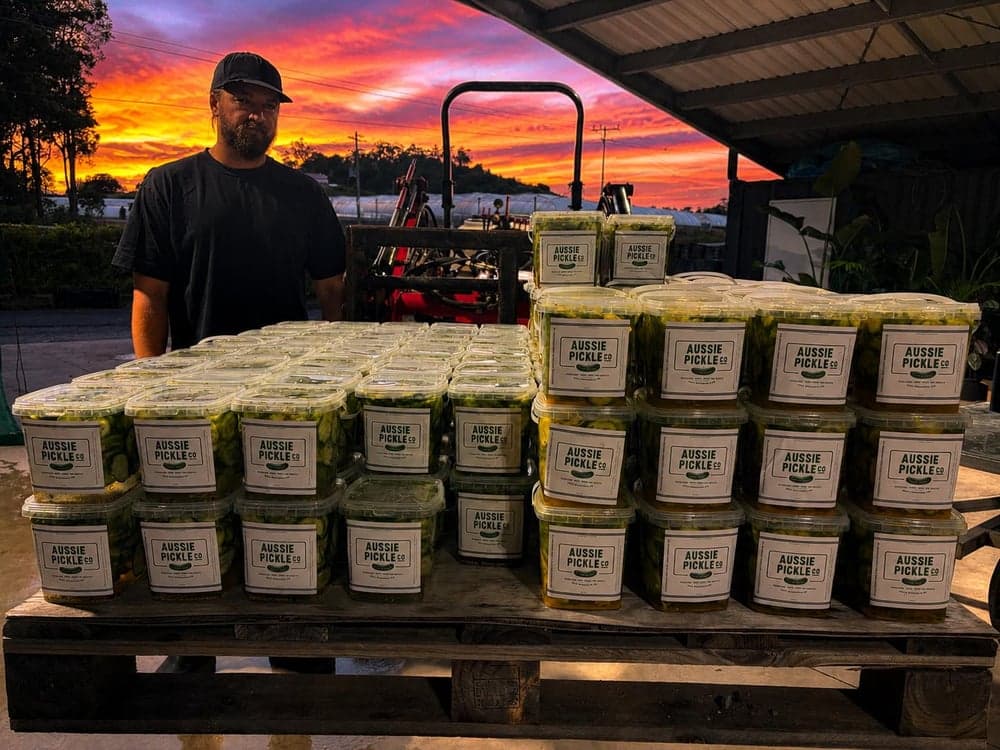 Dusty with a full pallet of freshly packed 1L pickle tubs at sunset